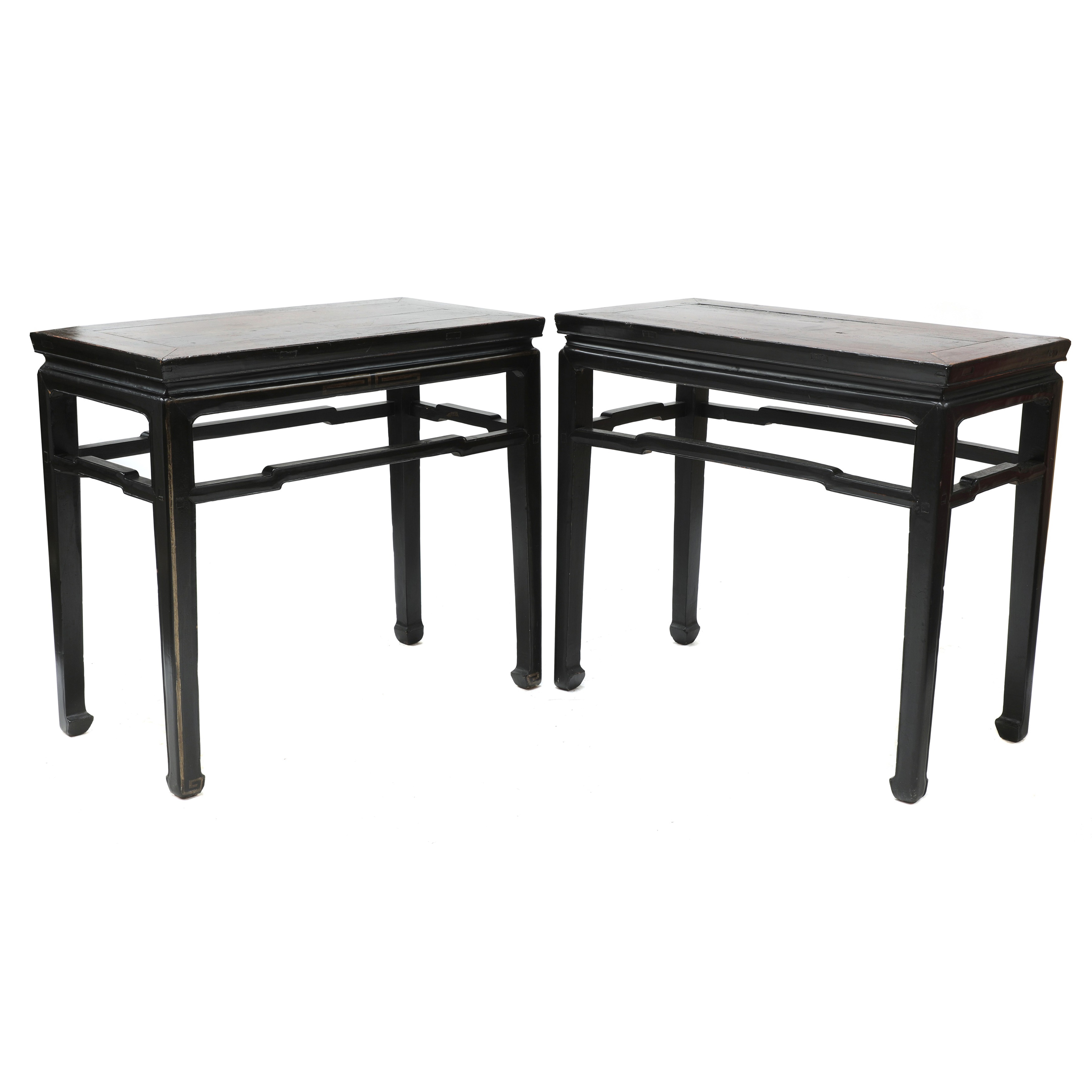 A pair of Chinese ebonised and parcel-gilt hardwood low tables